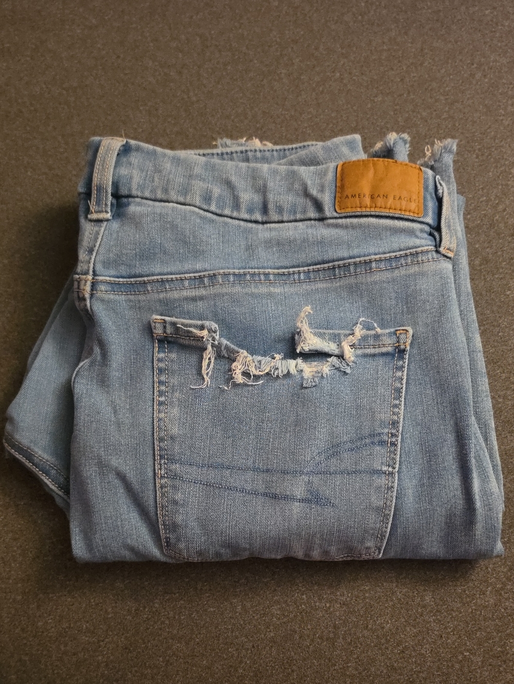 American Eagle Outfitters Light Wash Skinny Jeans with Back Pocket Distress